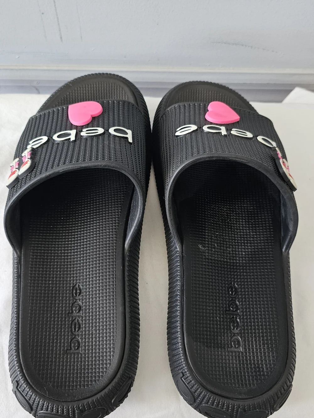 bebe Black Slide Sandals with Pink Heart Accent